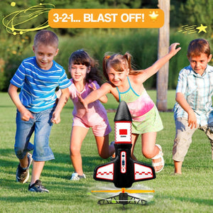 Sky & Beyond Rocket Launcher toy with parachute mid-launch outdoors