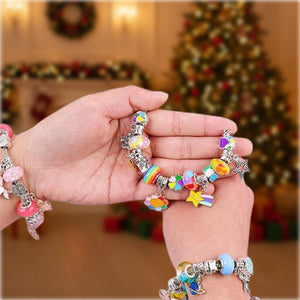 Kids holding colorful charm bracelets made with Christmas-themed Bracelet-Making Kit