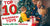 Grandparents gifting a wrapped Christmas present to their grandson by a decorated Christmas tree.