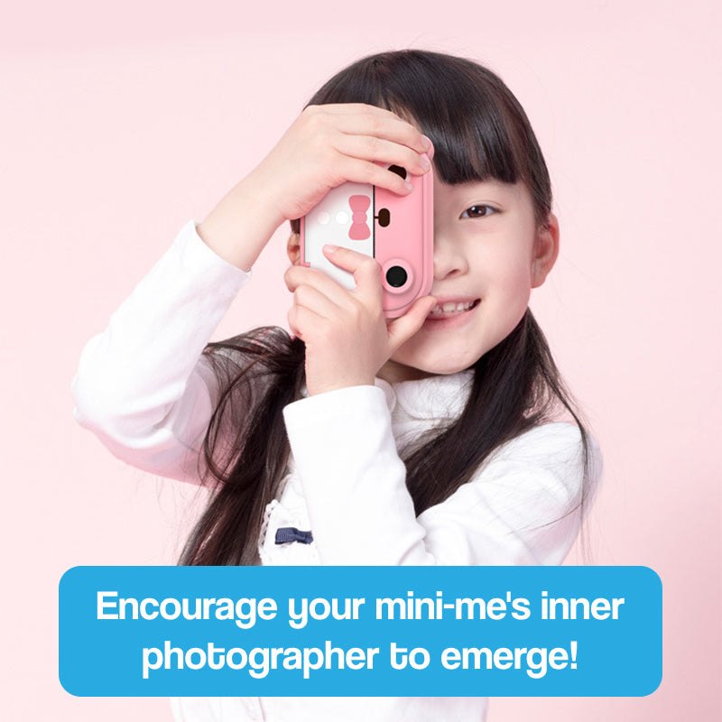 child holding pink instant print camera encouraging young photographers creativity Christmas collection